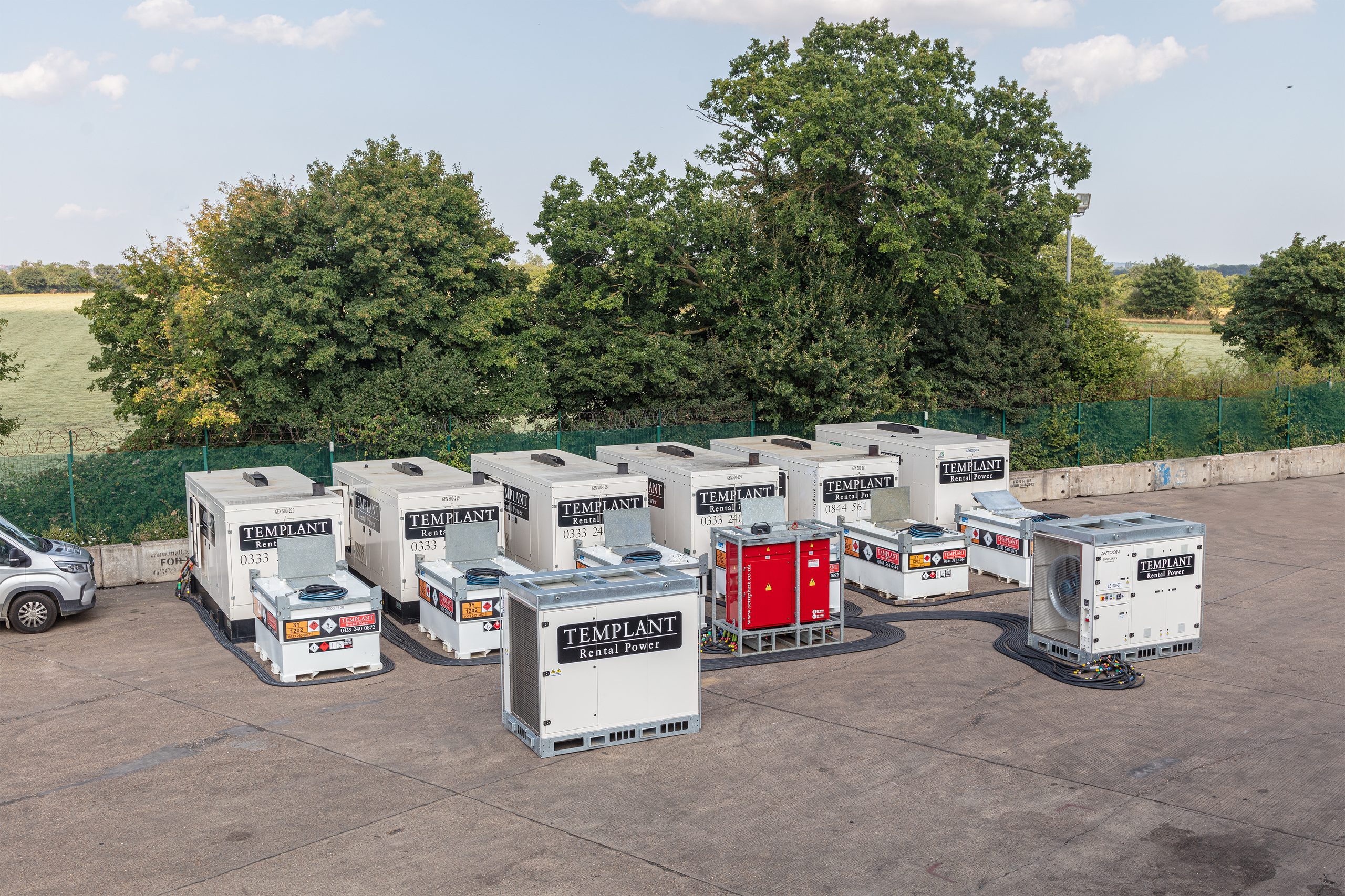 Templant Rental Power generators operating alongside fuel tanks and power distribution equipment at an industrial site.